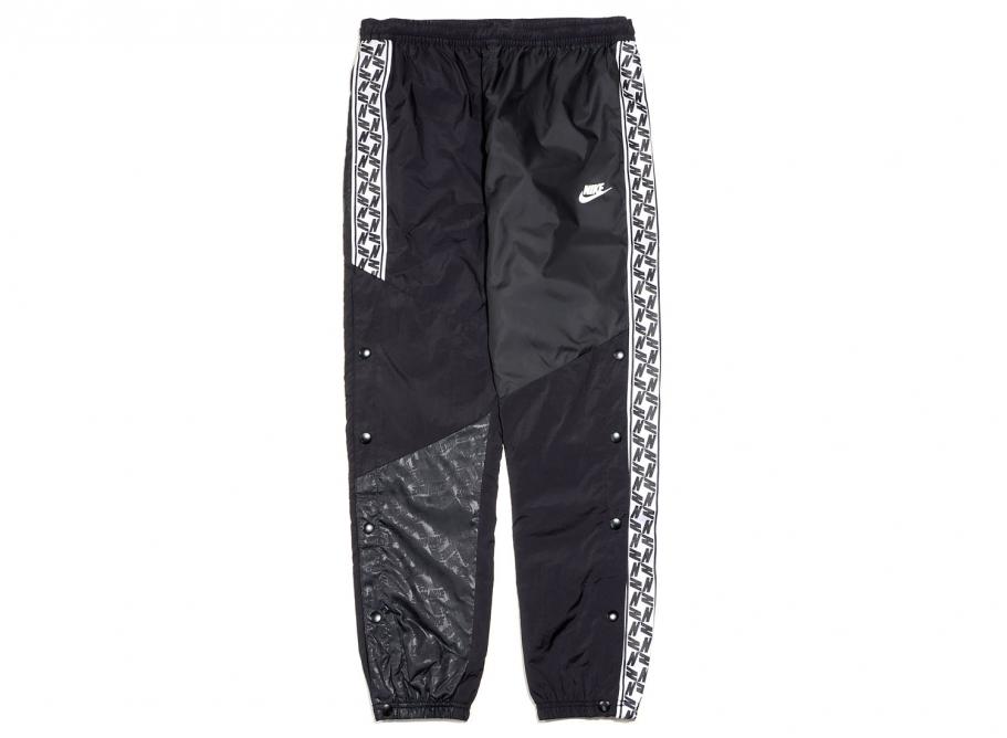 nike woven taping cuffed joggers in black